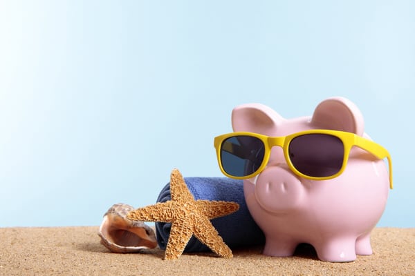 women and retirement planning+piggy w sunglasses