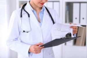 choose-a-doctor-at-midlife_doctor-with-clipboard