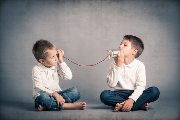 Sibling friction over elder care+boys-tin-can-phones