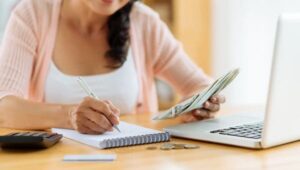 retirement planning in midlife+woman-notepad-computer